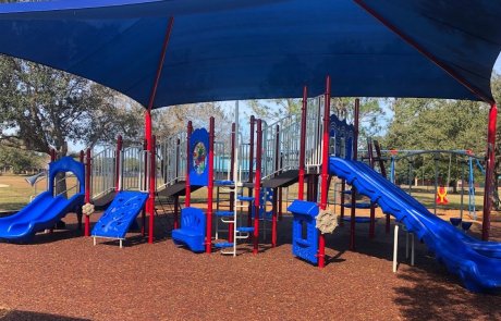 Eastwood wide blue and red playground equipment with blue shade | creativerecproducts.com
