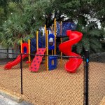 A blue and red Westside Christian School playground and fence Largo Tampa area